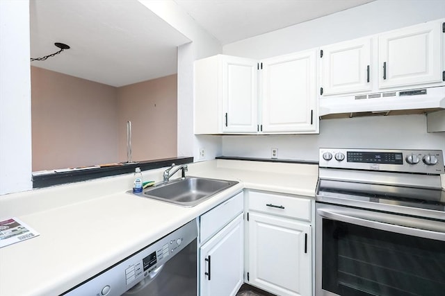 kitchen featuring white cabinets, appliances with stainless steel finishes, and sink