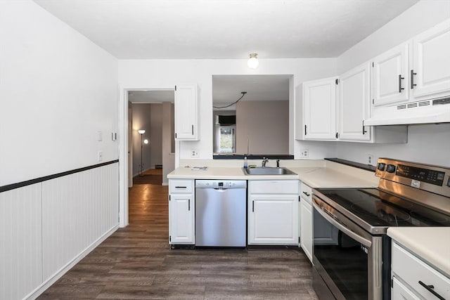 kitchen featuring custom range hood, stainless steel appliances, white cabinetry, and sink