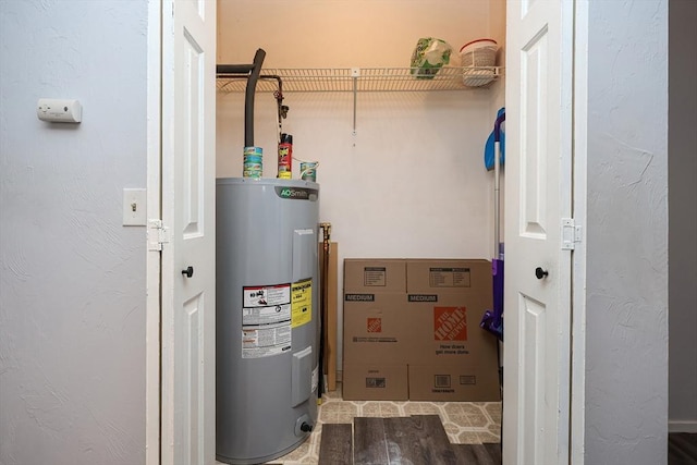 utility room with electric water heater