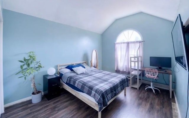 bedroom featuring lofted ceiling and dark wood-type flooring