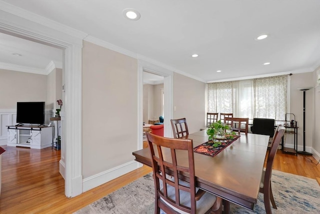 dining space featuring recessed lighting, ornamental molding, and light wood finished floors