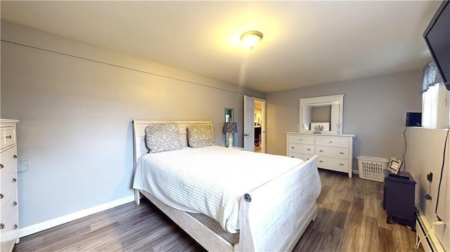 bedroom featuring dark hardwood / wood-style flooring and a baseboard radiator