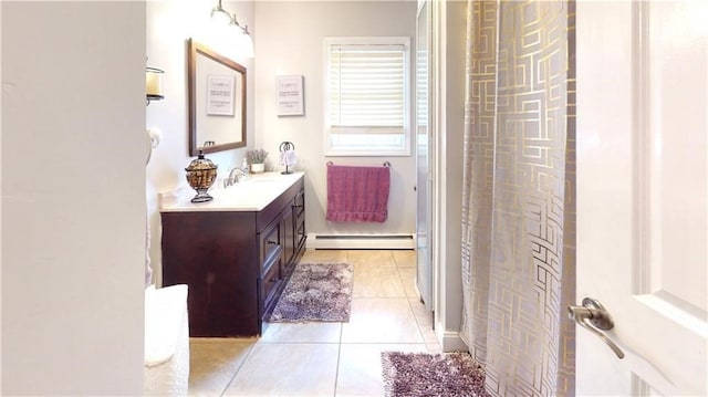 bathroom featuring tile patterned flooring, vanity, a shower with curtain, and a baseboard heating unit