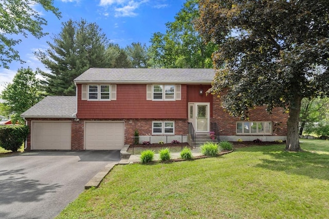 3 Biggar Ave, Wilmington, MA 01887 - split foyer home with driveway, entry steps, a front yard, and brick siding