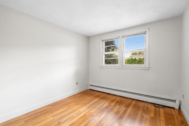 3 Biggar Ave, Wilmington, MA 01887 - unfurnished room with a baseboard heating unit, light wood-style flooring, and baseboards
