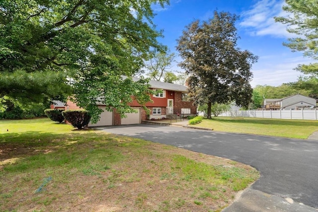 3 Biggar Ave, Wilmington, MA 01887 - view of front facade featuring driveway, a garage, and brick siding