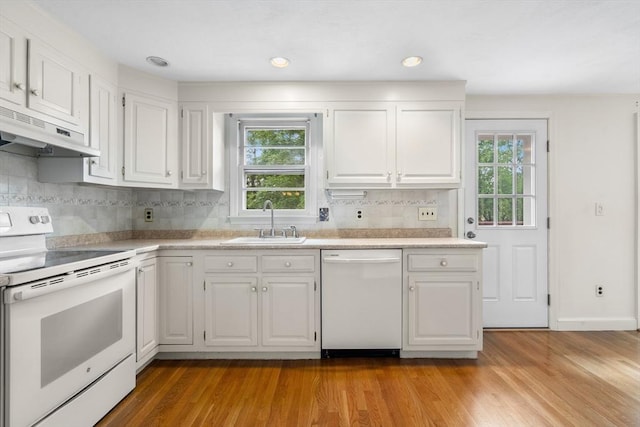 3 Biggar Ave, Wilmington, MA 01887 - kitchen with white appliances, under cabinet range hood, a sink, white cabinetry, and recessed lighting