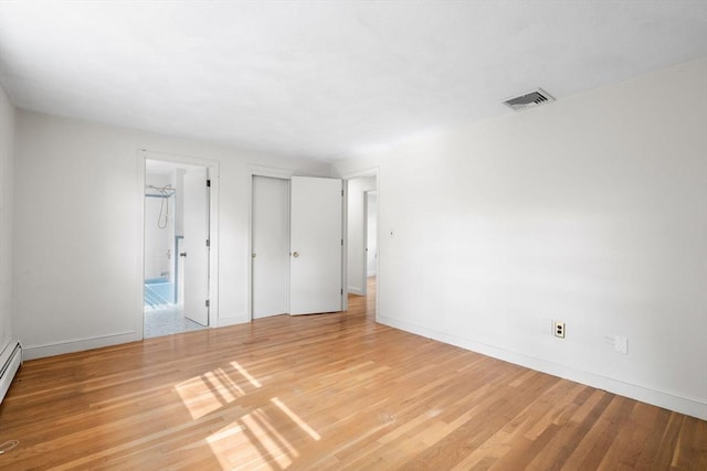 3 Biggar Ave, Wilmington, MA 01887 - unfurnished bedroom featuring light wood-type flooring, baseboards, ensuite bathroom, and baseboard heating