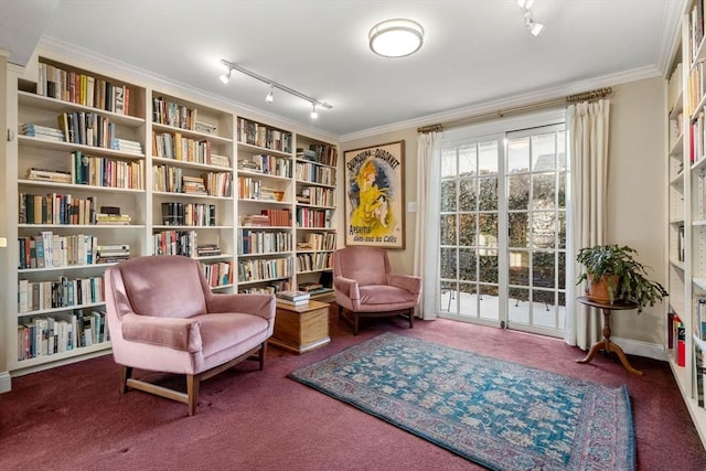 sitting room with crown molding, rail lighting, and carpet floors