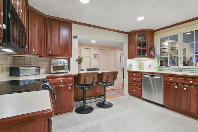 3 Tory Dr, Shrewsbury, MA 01545 - kitchen featuring stainless steel dishwasher, a sink, black microwave, light countertops, and tasteful backsplash