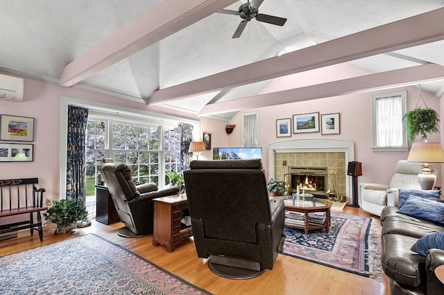 3 Tory Dr, Shrewsbury, MA 01545 - living room with light wood-style flooring, ceiling fan, a fireplace, a wall mounted air conditioner, and plenty of natural light