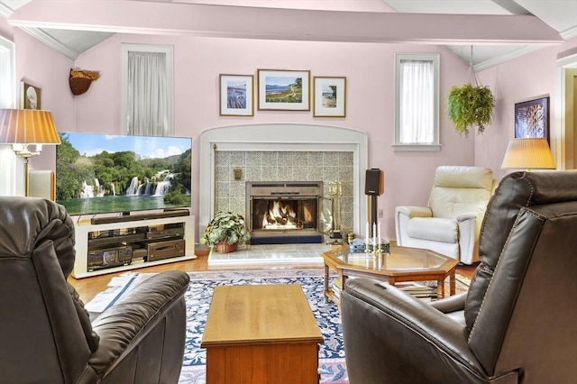 3 Tory Dr, Shrewsbury, MA 01545 - living room featuring crown molding, wood finished floors, a tiled fireplace, and vaulted ceiling