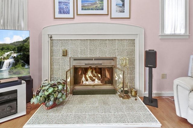 3 Tory Dr, Shrewsbury, MA 01545 - detailed view of a tile fireplace, wood finished floors, and baseboards