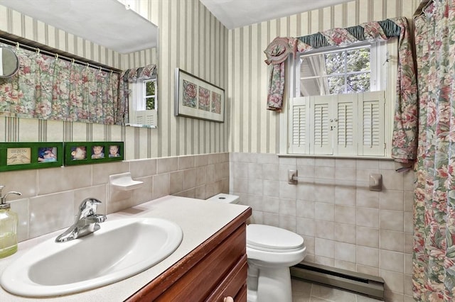 3 Tory Dr, Shrewsbury, MA 01545 - full bath with a baseboard radiator, wallpapered walls, toilet, tile walls, and vanity