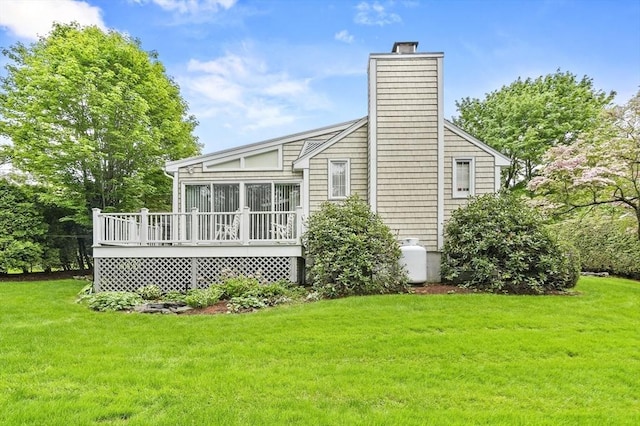 3 Tory Dr, Shrewsbury, MA 01545 - back of house with a wooden deck, a chimney, and a lawn