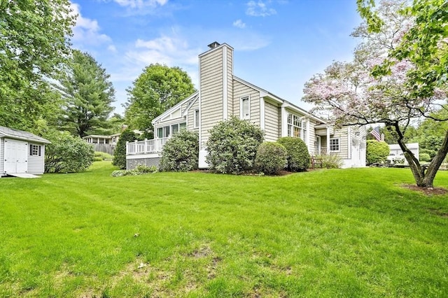 3 Tory Dr, Shrewsbury, MA 01545 - view of property exterior featuring a lawn, a chimney, and a wooden deck