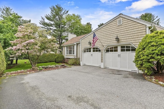 3 Tory Dr, Shrewsbury, MA 01545 - view of front of property featuring a chimney, asphalt driveway, and an attached garage