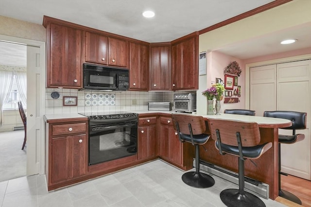 3 Tory Dr, Shrewsbury, MA 01545 - kitchen featuring black appliances, light countertops, a peninsula, backsplash, and recessed lighting