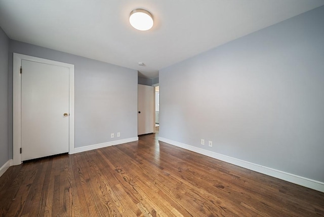 123 Walnut St, Saugus, MA 01906 - unfurnished bedroom featuring baseboards and wood finished floors