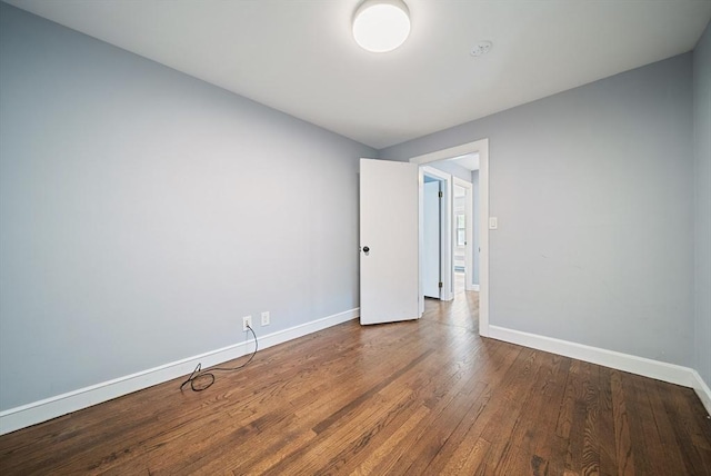 123 Walnut St, Saugus, MA 01906 - empty room with wood finished floors and a smoke detector