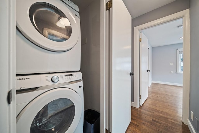 123 Walnut St, Saugus, MA 01906 - washroom featuring stacked washing machine and dryer and dark wood-style flooring