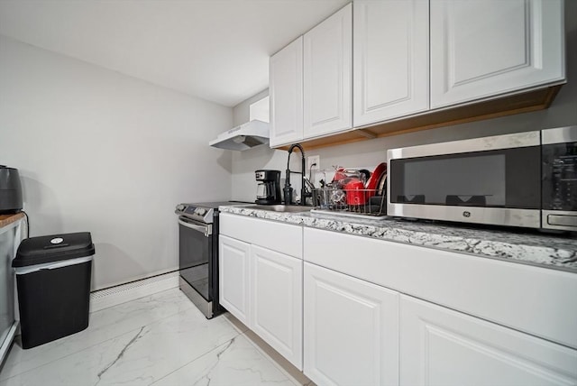 123 Walnut St, Saugus, MA 01906 - kitchen featuring appliances with stainless steel finishes, light marble finish flooring, white cabinets, under cabinet range hood, and light stone counters