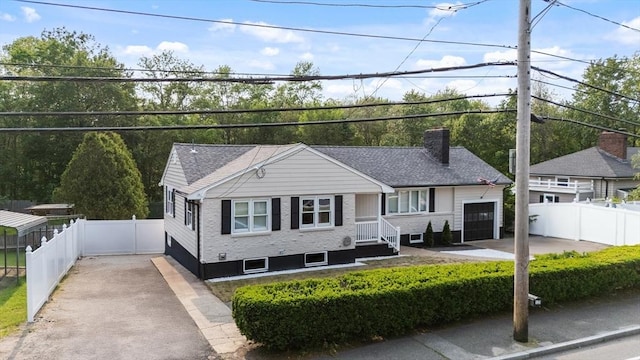 123 Walnut St, Saugus, MA 01906 - ranch-style home featuring a chimney, a garage, driveway, and roof with shingles