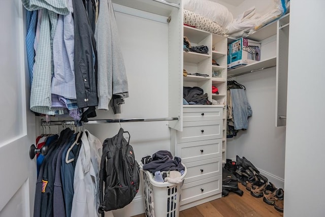 spacious closet with wood finished floors