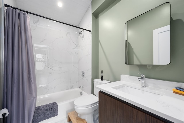 bathroom featuring shower / bath combo, vanity, and toilet