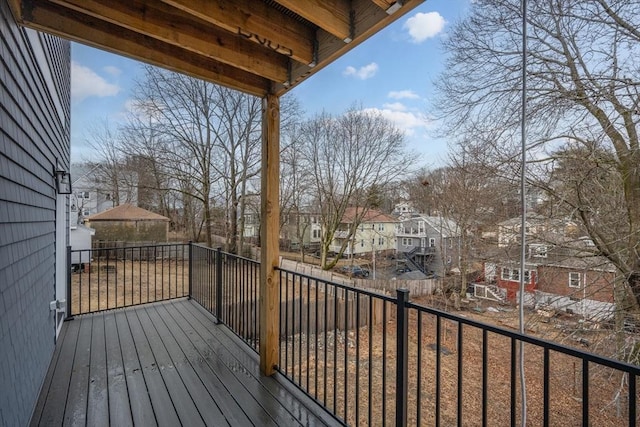 wooden deck featuring a residential view