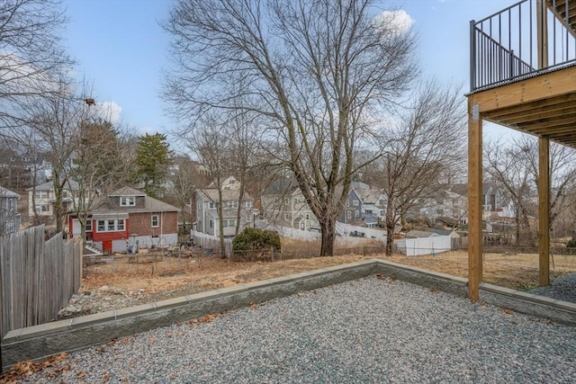 view of yard with a residential view and fence