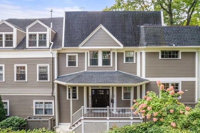 view of front facade featuring a porch and a shingled roof