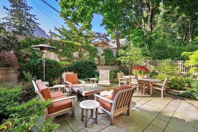 view of patio / terrace featuring outdoor dining area and a fenced backyard