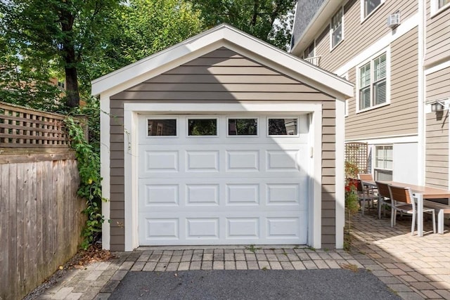 detached garage with fence