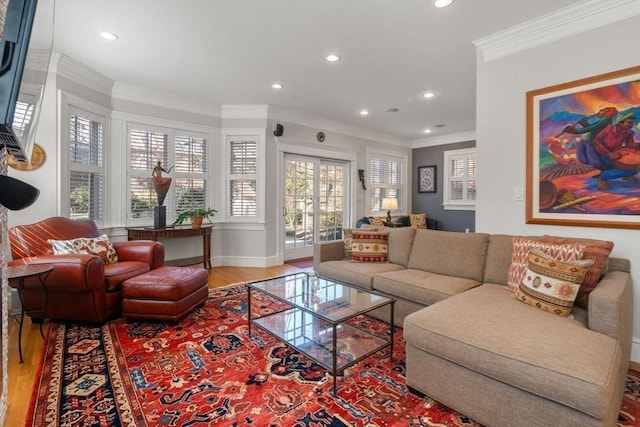 living area featuring crown molding, recessed lighting, wood finished floors, and baseboards