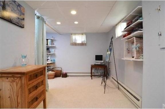 office featuring recessed lighting, carpet flooring, and a baseboard heating unit