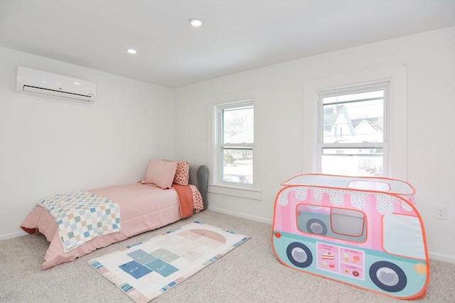 carpeted bedroom featuring an AC wall unit