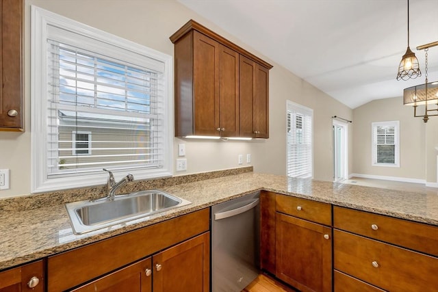 kitchen with light stone countertops, stainless steel dishwasher, sink, hanging light fixtures, and lofted ceiling