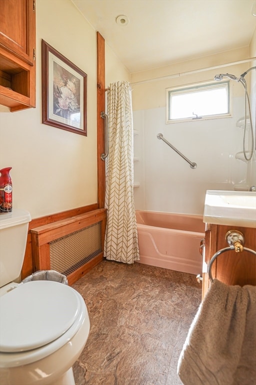 full bathroom with toilet, vanity, and shower / tub combo with curtain