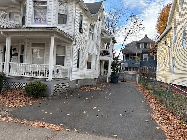 view of property exterior featuring a porch