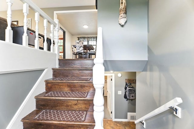 stairs featuring baseboards