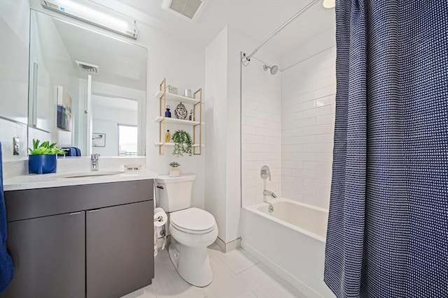 full bathroom with tile patterned floors, vanity, shower / tub combo, and toilet