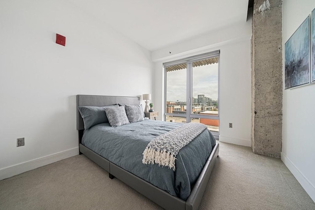 bedroom featuring light carpet