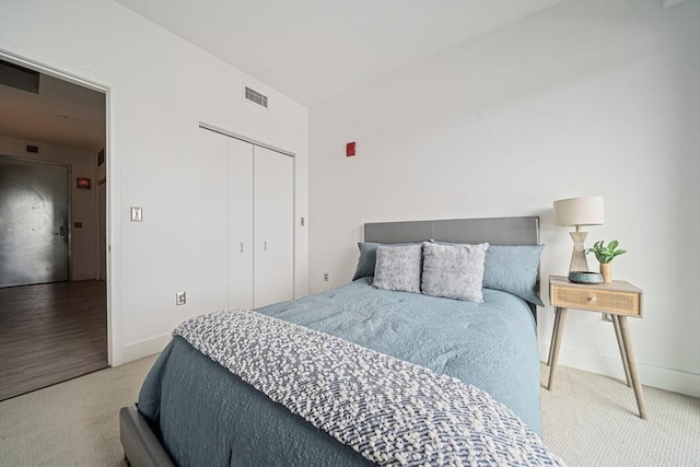 carpeted bedroom with a closet