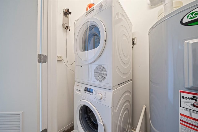 laundry area with stacked washer and dryer