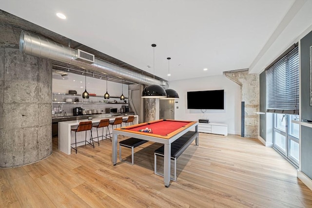 rec room with light hardwood / wood-style flooring and billiards