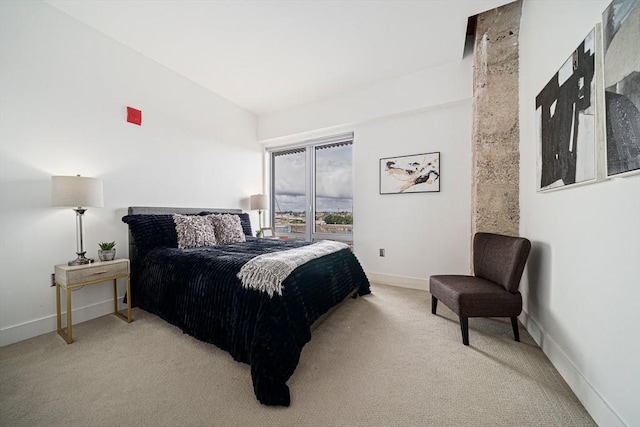 bedroom with light colored carpet