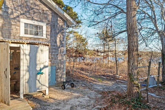 view of yard featuring a storage unit and an outdoor structure