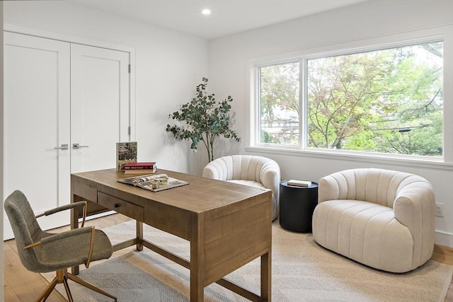 office space featuring light wood-style floors and recessed lighting