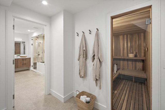 mudroom with baseboards and recessed lighting
